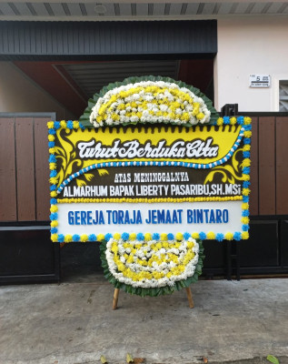 Papan Bunga Duka di Mulo